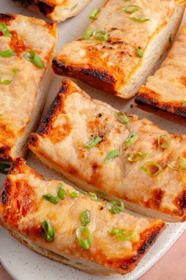 sliced cheesy gochujang garlic bread on a plate