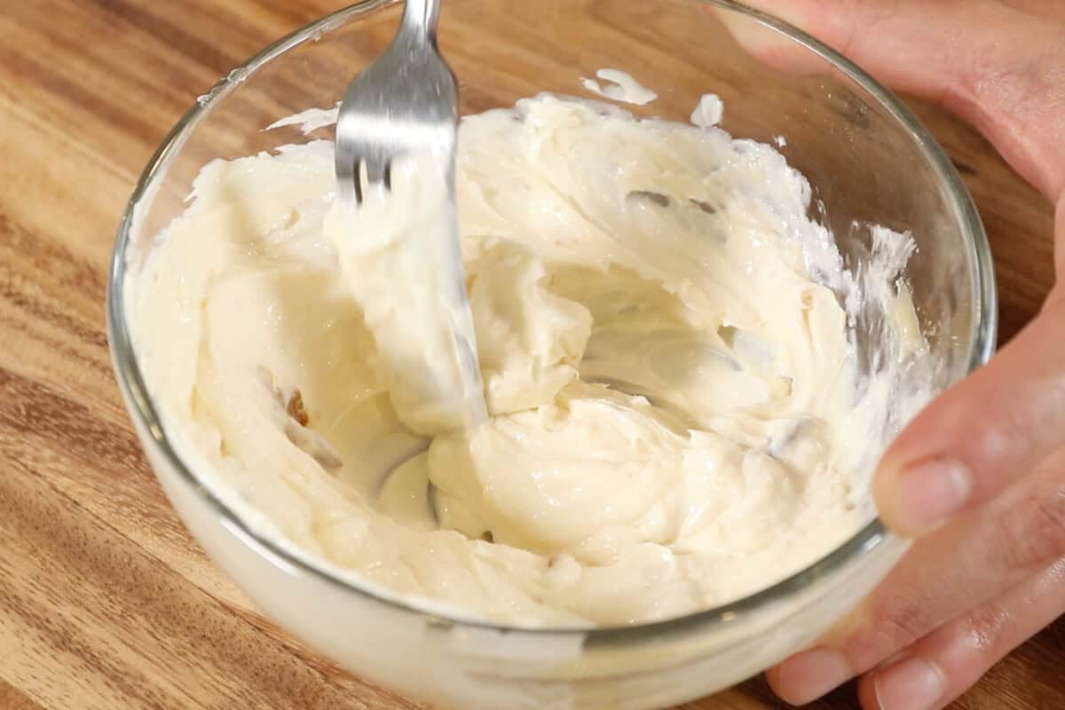 mixing the garlic and butter together