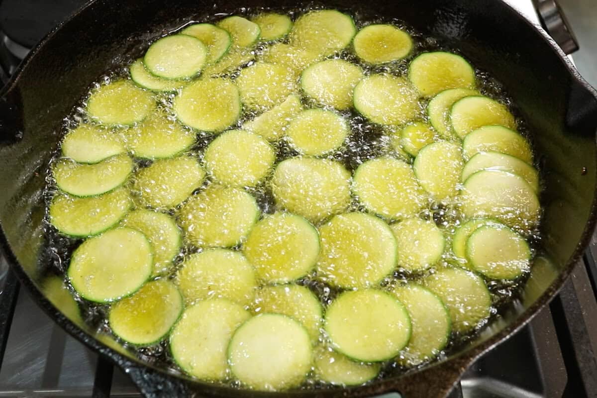 frying zucchini in a cast iron skillet