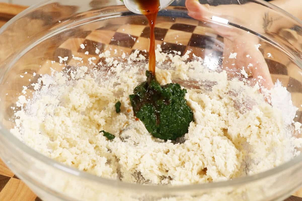 creamed vegan butter and sugar being mixed with matcha and vanilla extract for Vegan Matcha Sugar Cookies