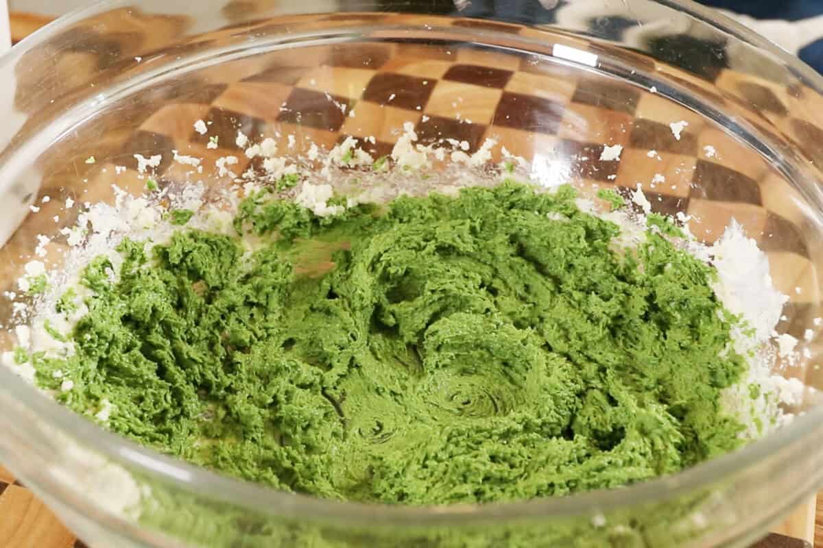 preparing Vegan Matcha Sugar Cookies in a large glass bowl