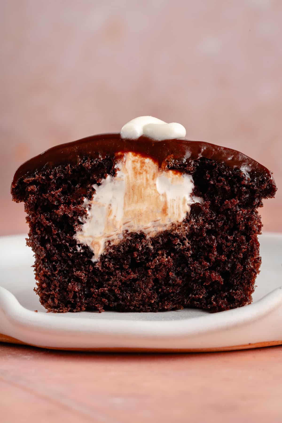 half of hostess cupcake with cream filling