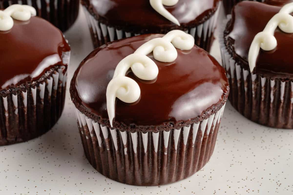 vegan copycat hostess cupcakes on white plate