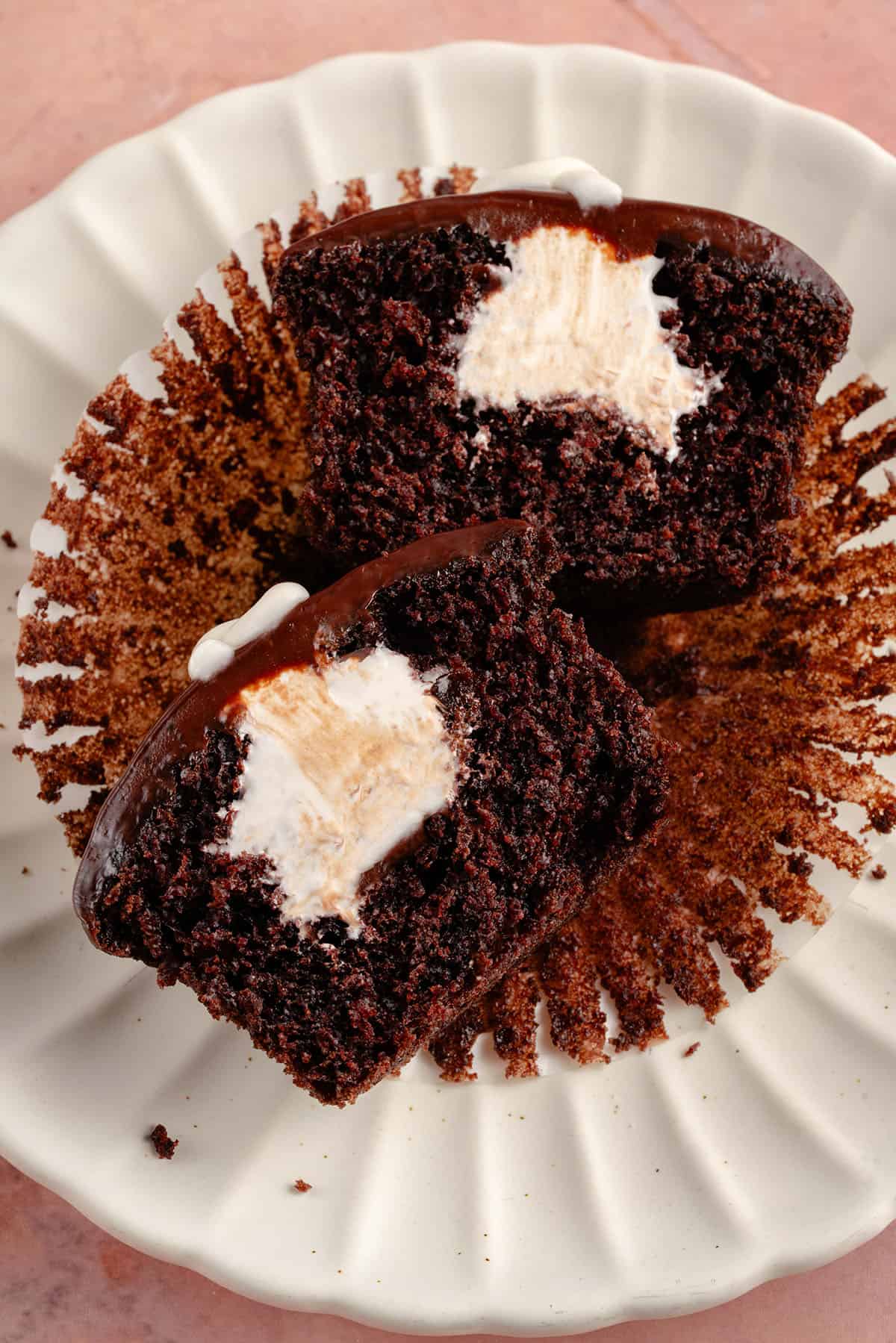 hostess cupcake cut in half on white plate