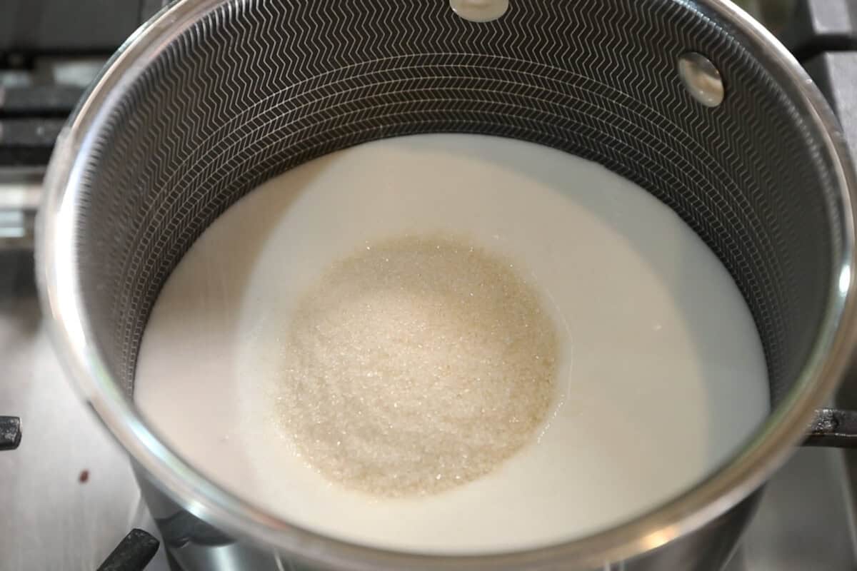 melting sugar into coconut milk for mango sticky rice recipe