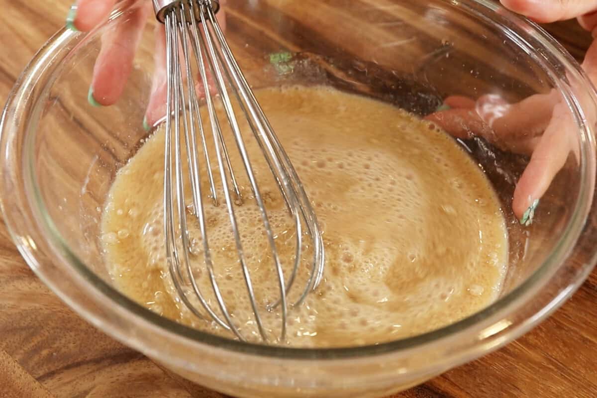 whisking together the liquid ingredients