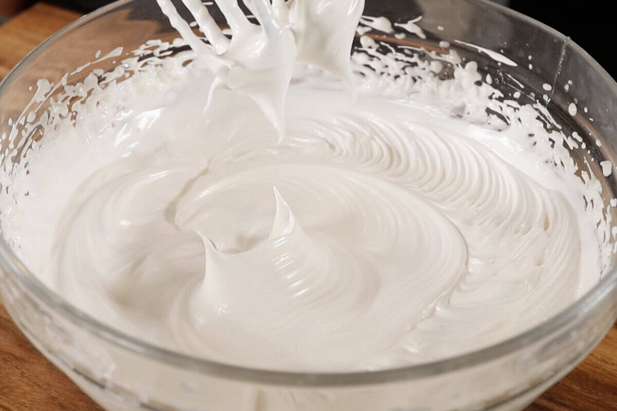 whipped vegan meringue in large glass bowl