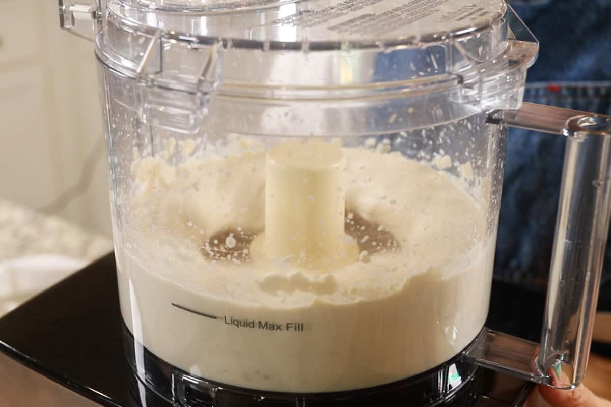 preparing a chocolate tofu filling for S'mores Pie in a food processor