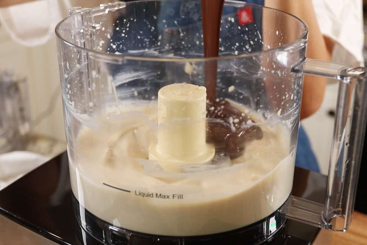 preparing a chocolate tofu filling for S'mores Pie in a food processor