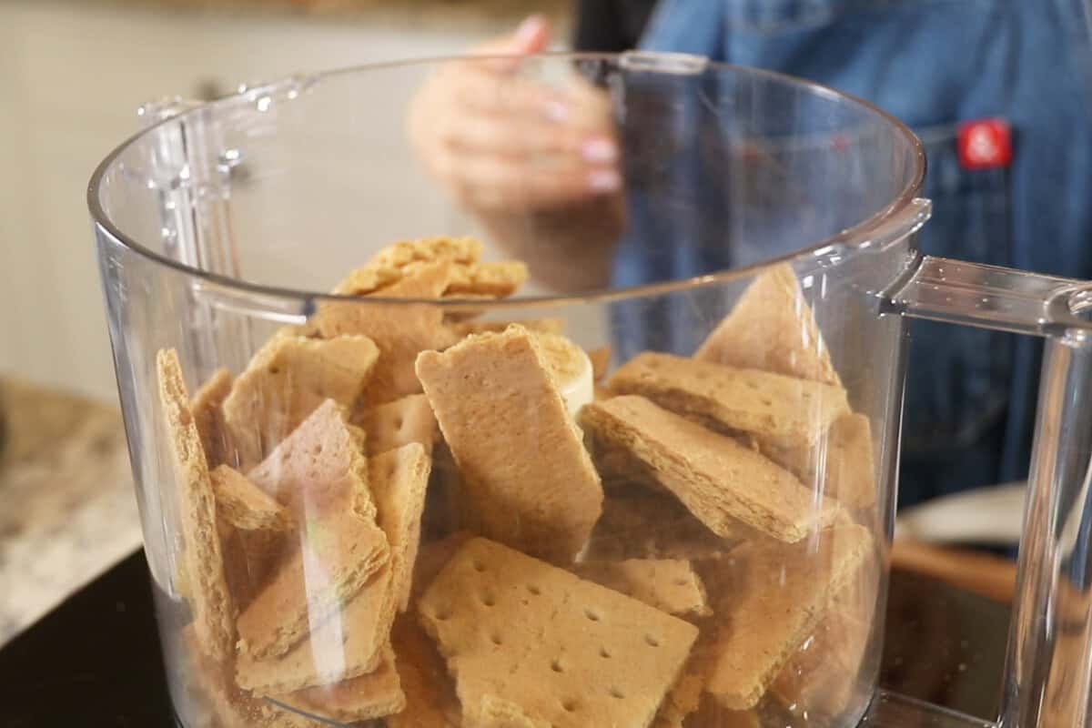 adding graham crackers to food processor