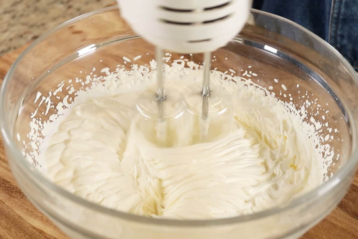 whipping the cream filling in large bowl