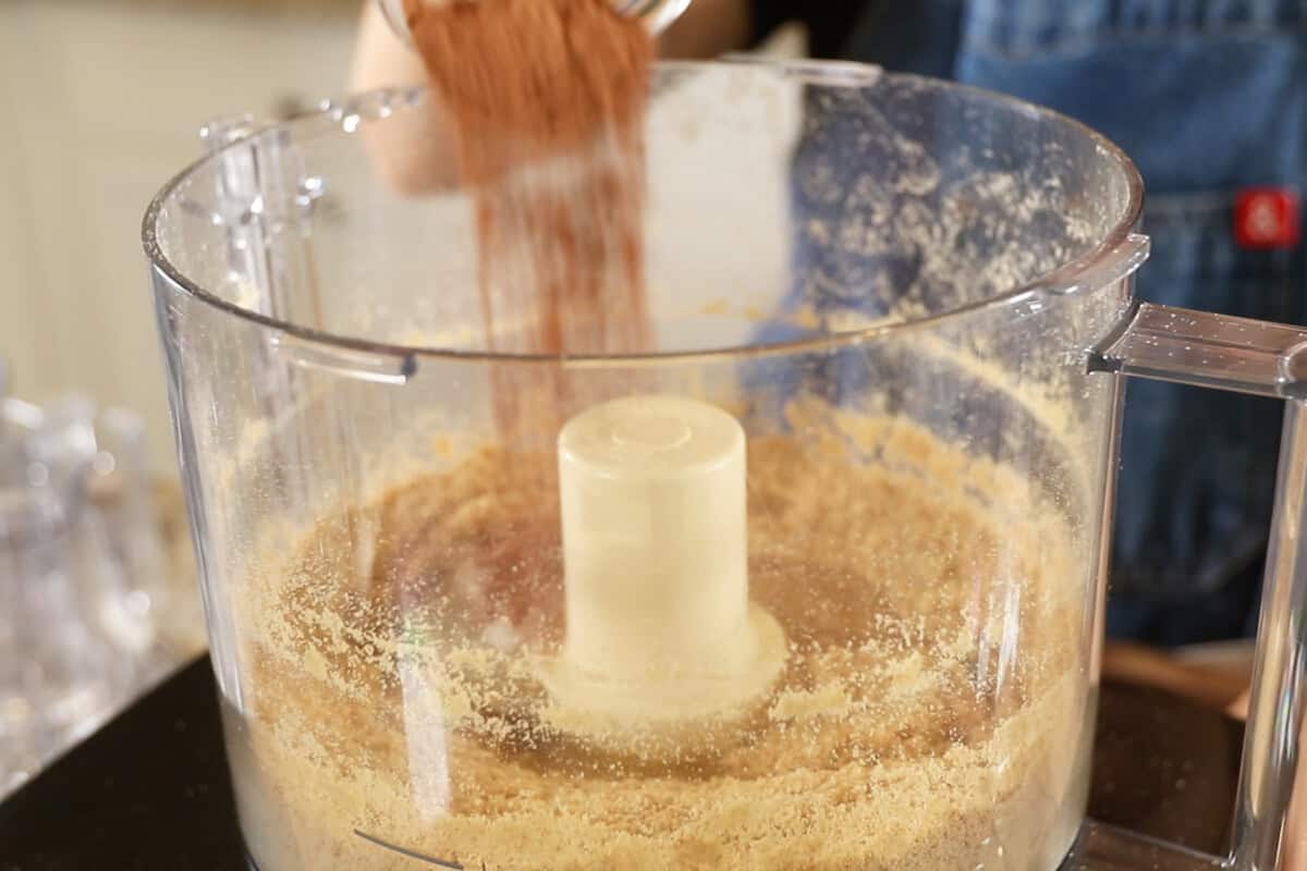 adding cocoa powder to food processor