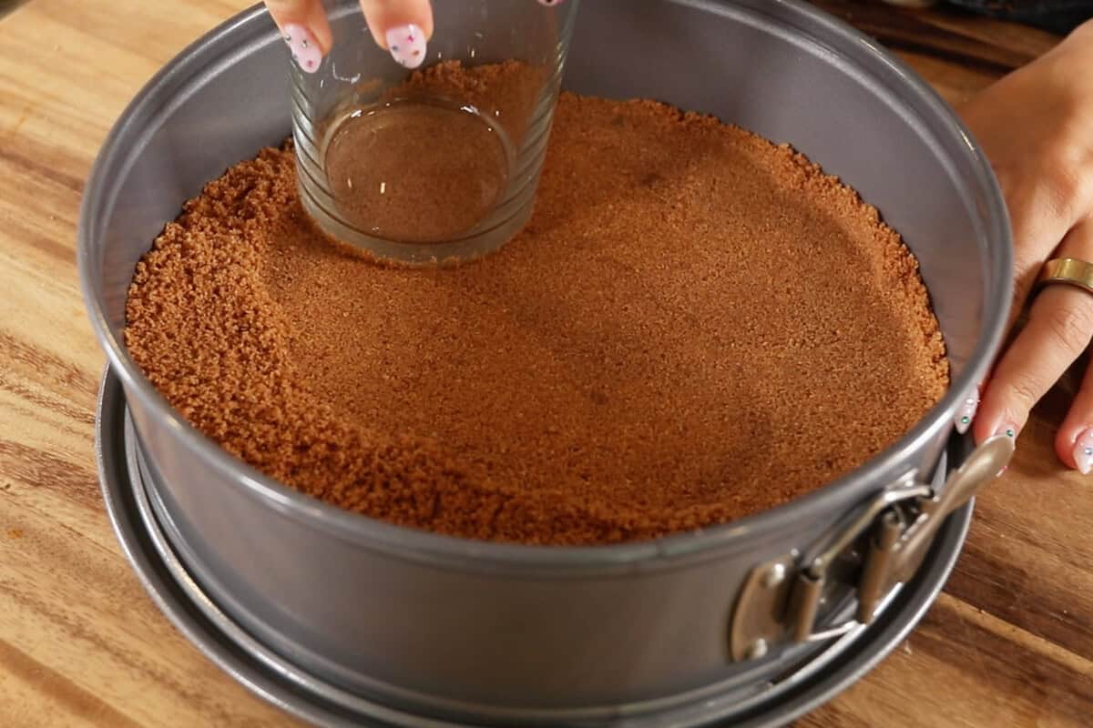 pressing down crust in springform pan