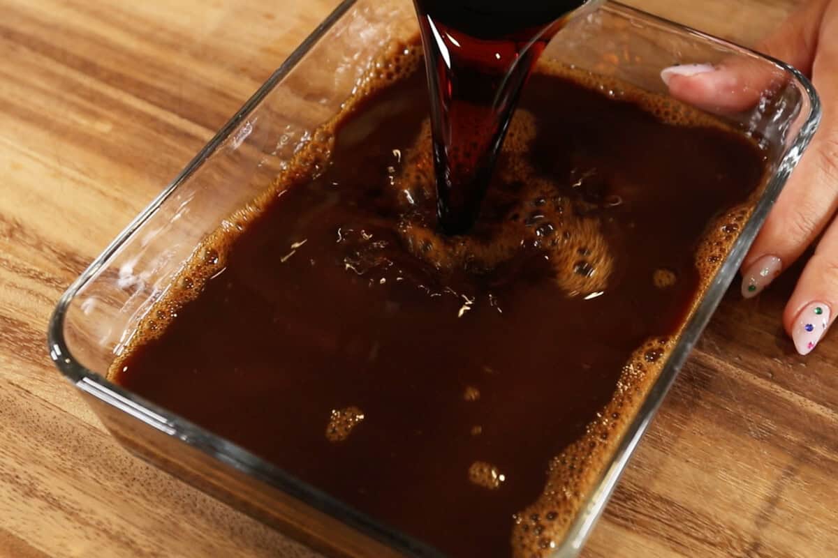 pouring coffee into wide dish