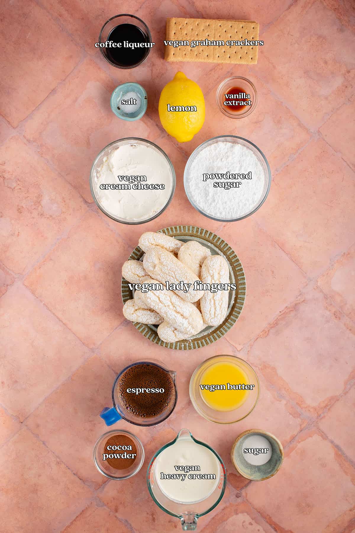 coffee liqueur, vegan graham crackers, salt, lemon, vanilla extract, vegan cream cheese, powdered sugar, vegan lady fingers, espresso, vegan butter, cocoa powder, vegan heavy cream, sugar