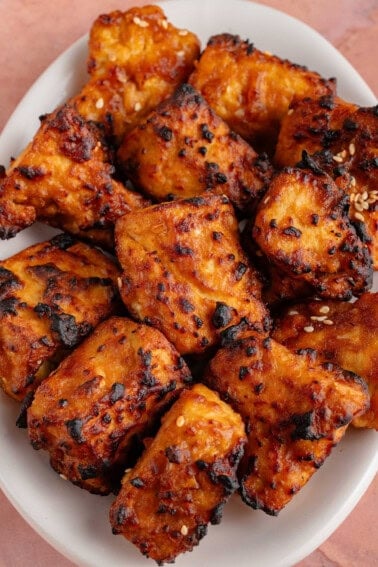 air fried miso sesame tofu piled on a plate