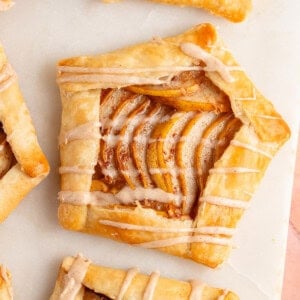 Mini Spiced Pear Galettes with maple glaze on marble board