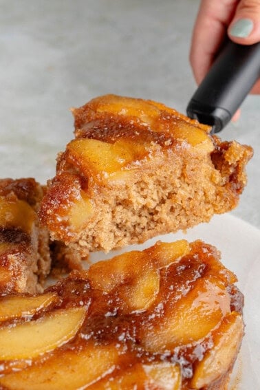 lifting a slice of caramel apple upside down cake out
