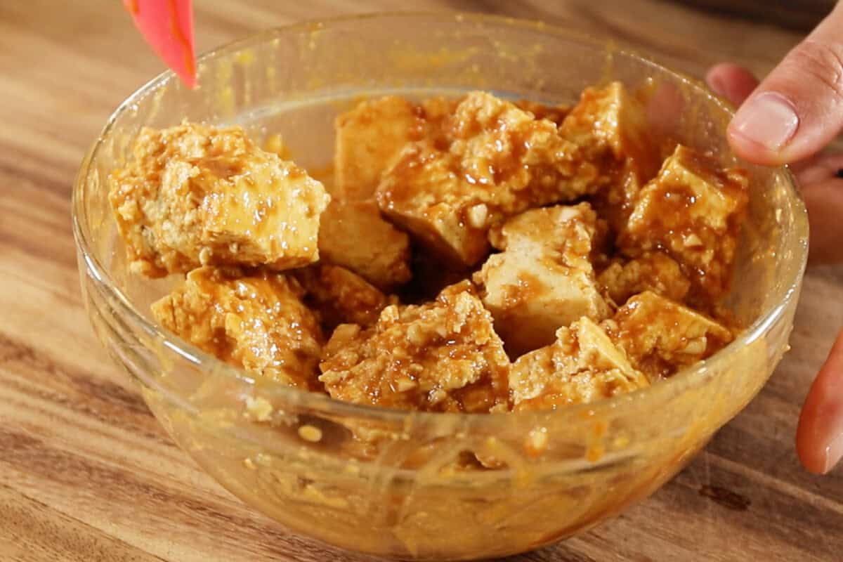 mixed sauce and tofu in a bowl