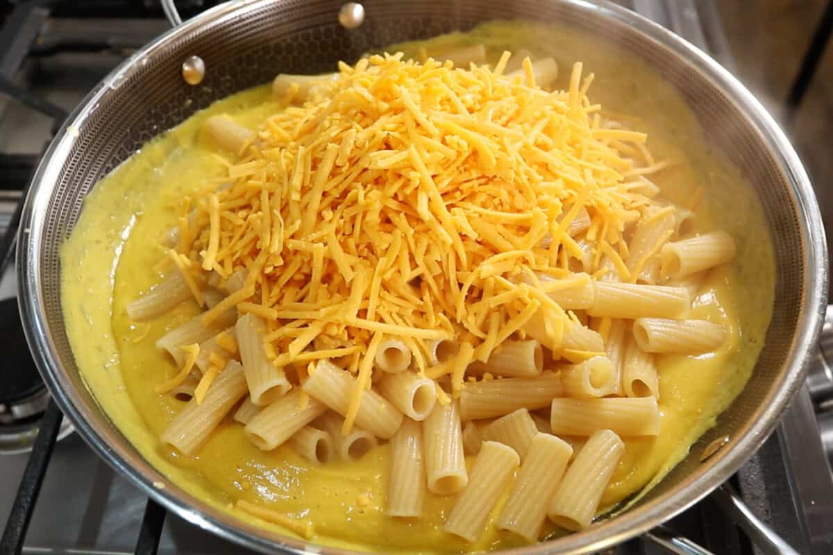 adding cheese to skillet