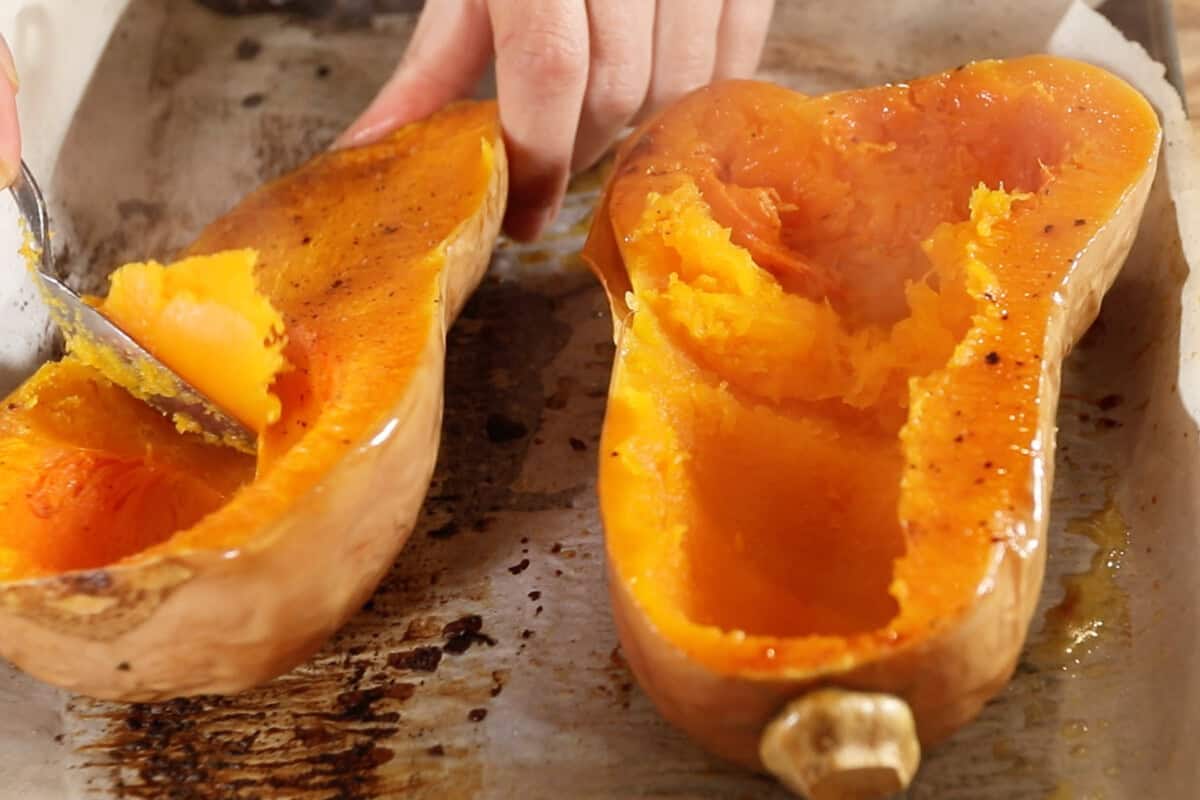 scooping out the roasted butternut squash