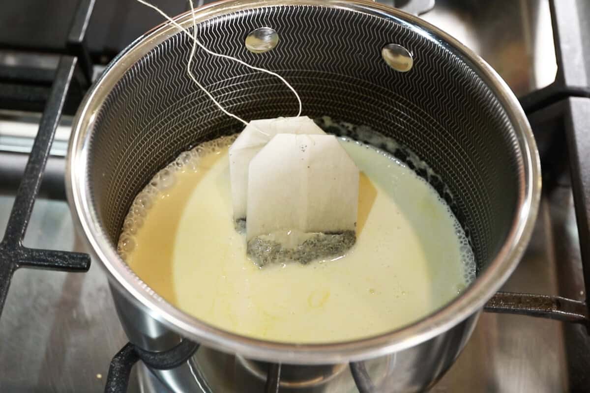 steeping chai tea bags in saucepan