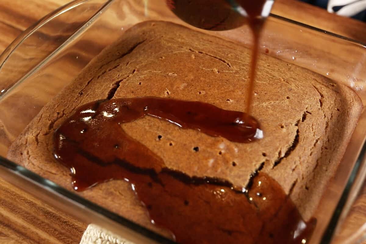 pouring syrup over toffee pudding