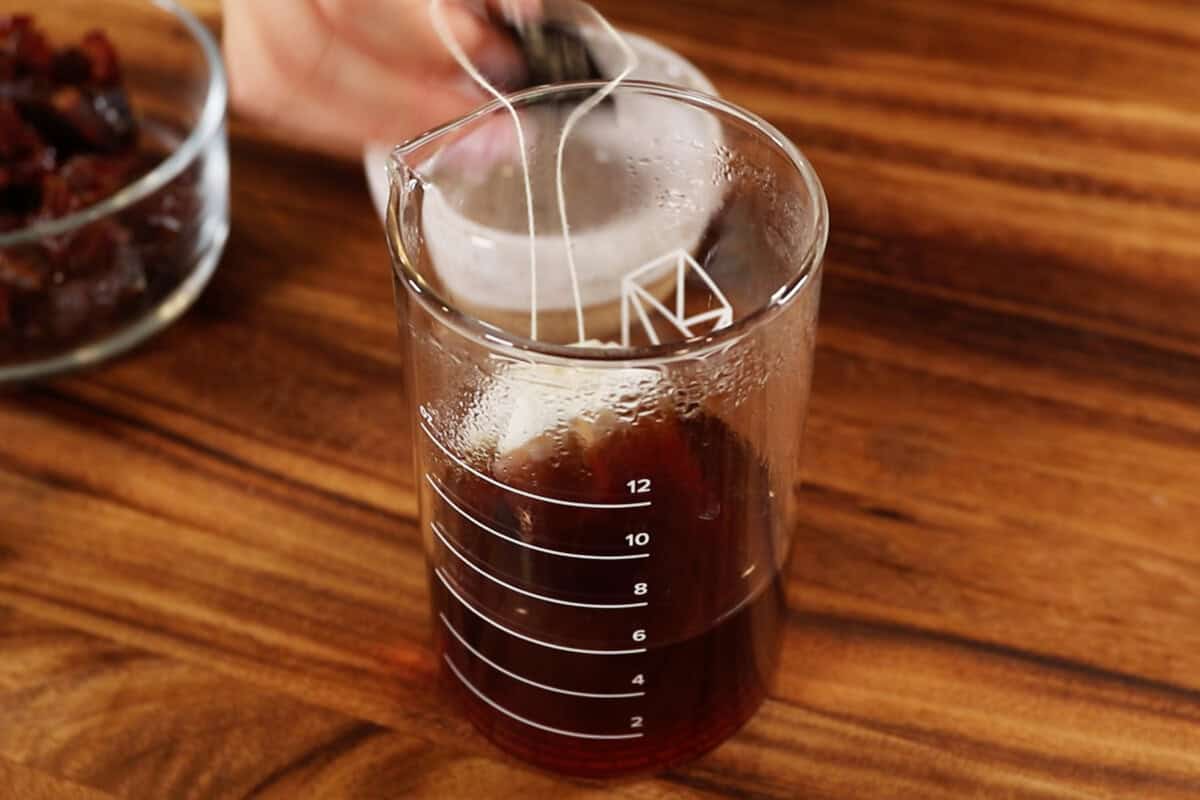 steeping tea bags in beaker