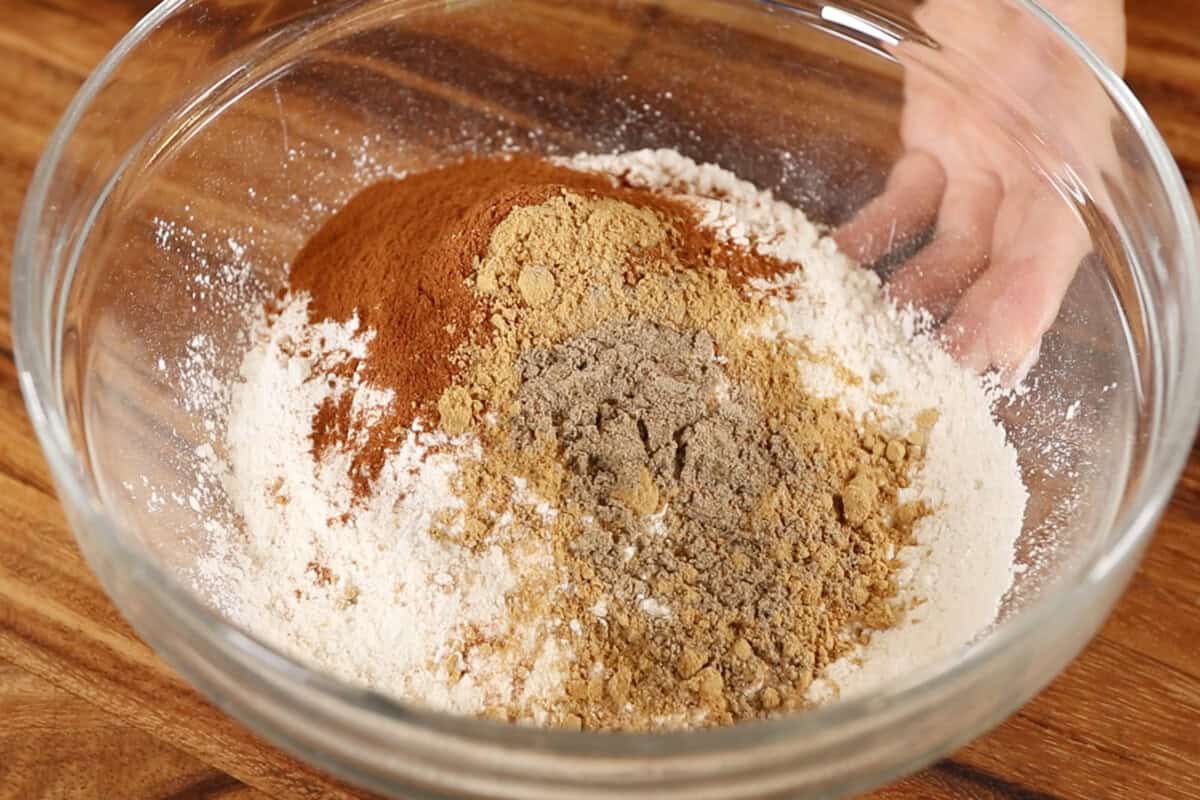adding spices to bowl