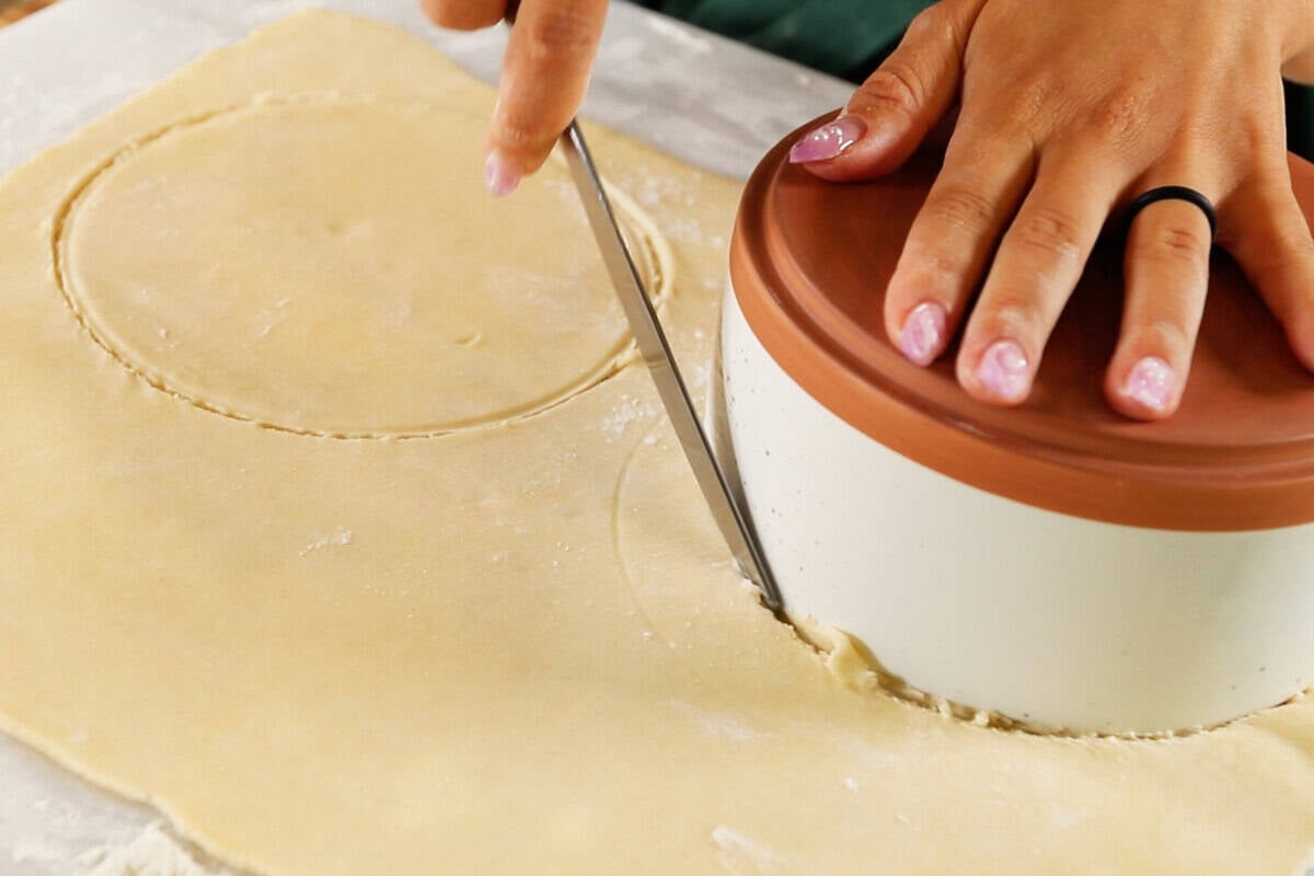 rolling out pie crust for Mini Spiced Pear Galettes