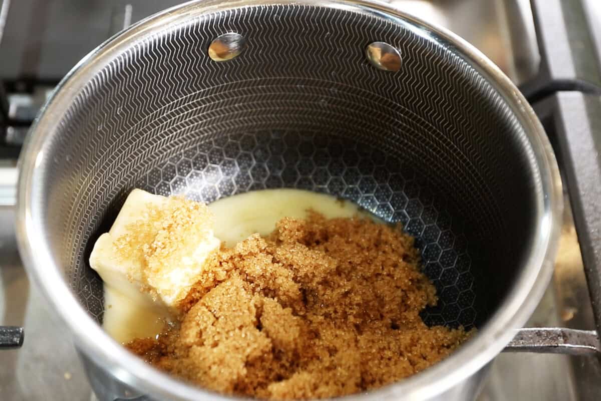 adding brown sugar and butter to sauce pan