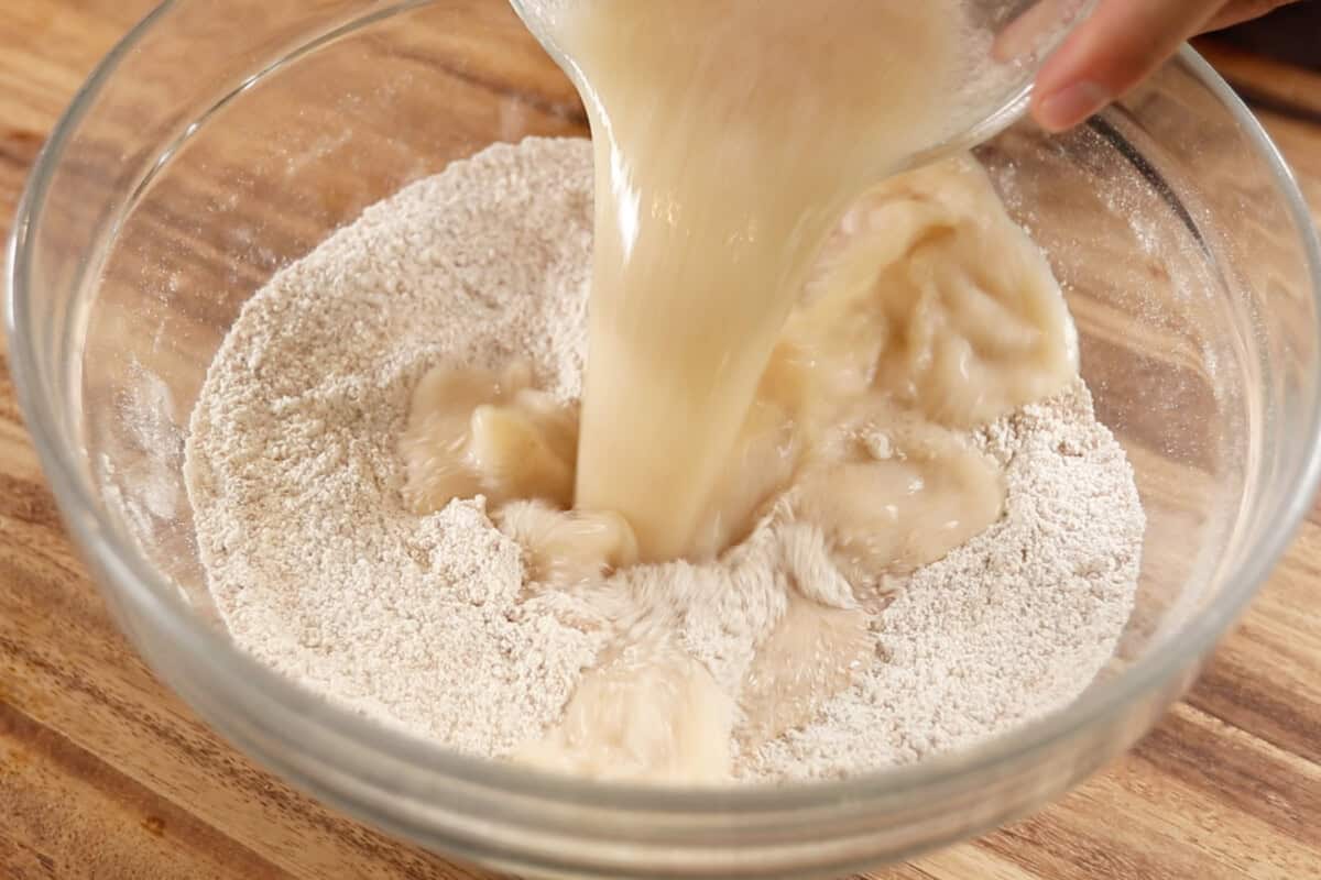 pouring the liquid into the dry mixture