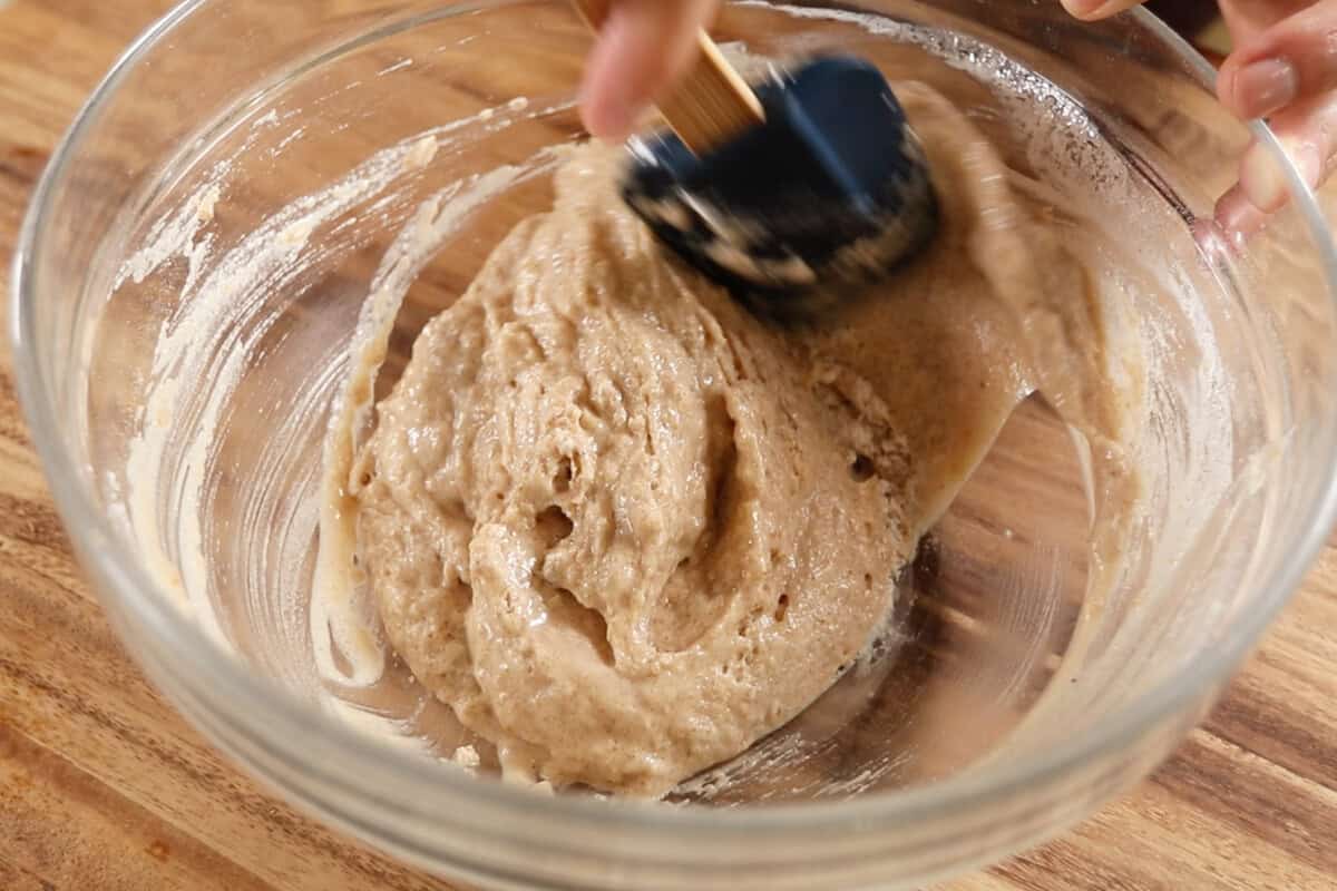mixing the cake batter in a large bowl