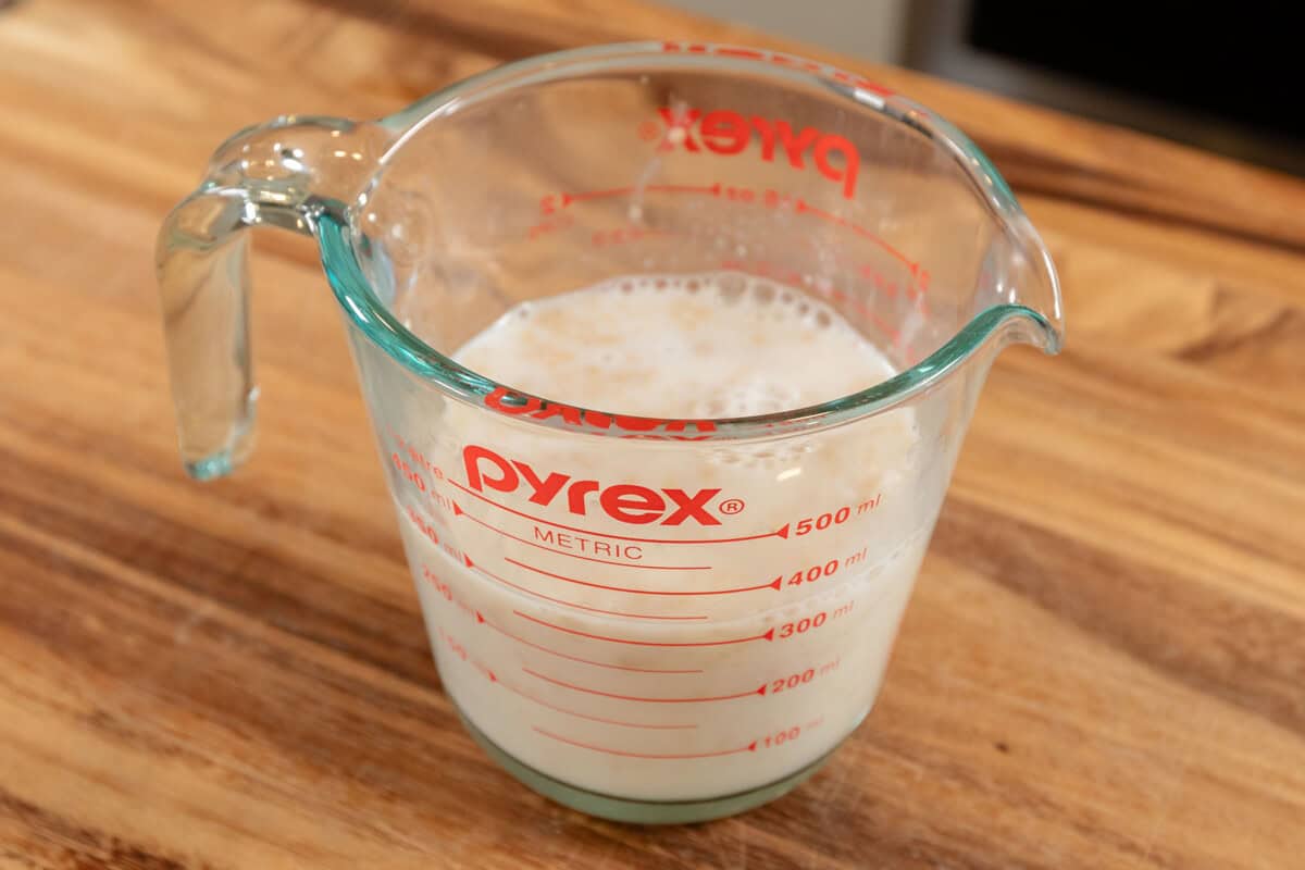 milk and yeast in measuring cup before activating