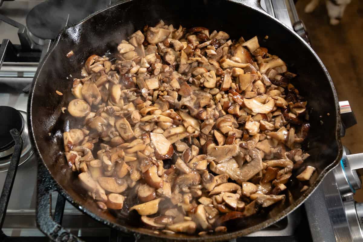 cooking mushrooms in large cast iron skillet for pot pie