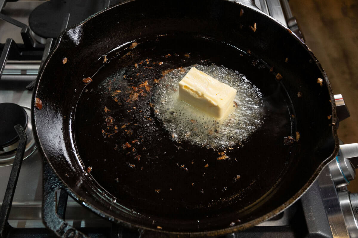 melting vegan butter in large cast iron skillet for pot pie
