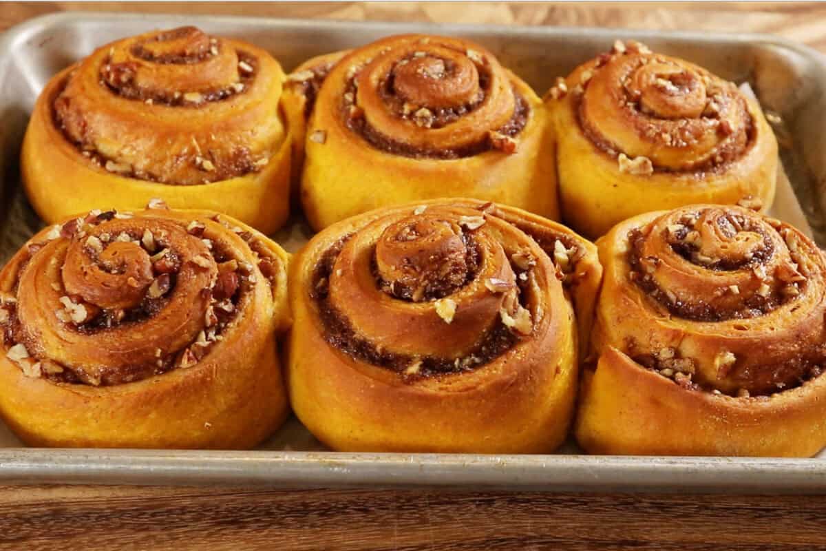 baked cinnamon rolls in a baking sheet