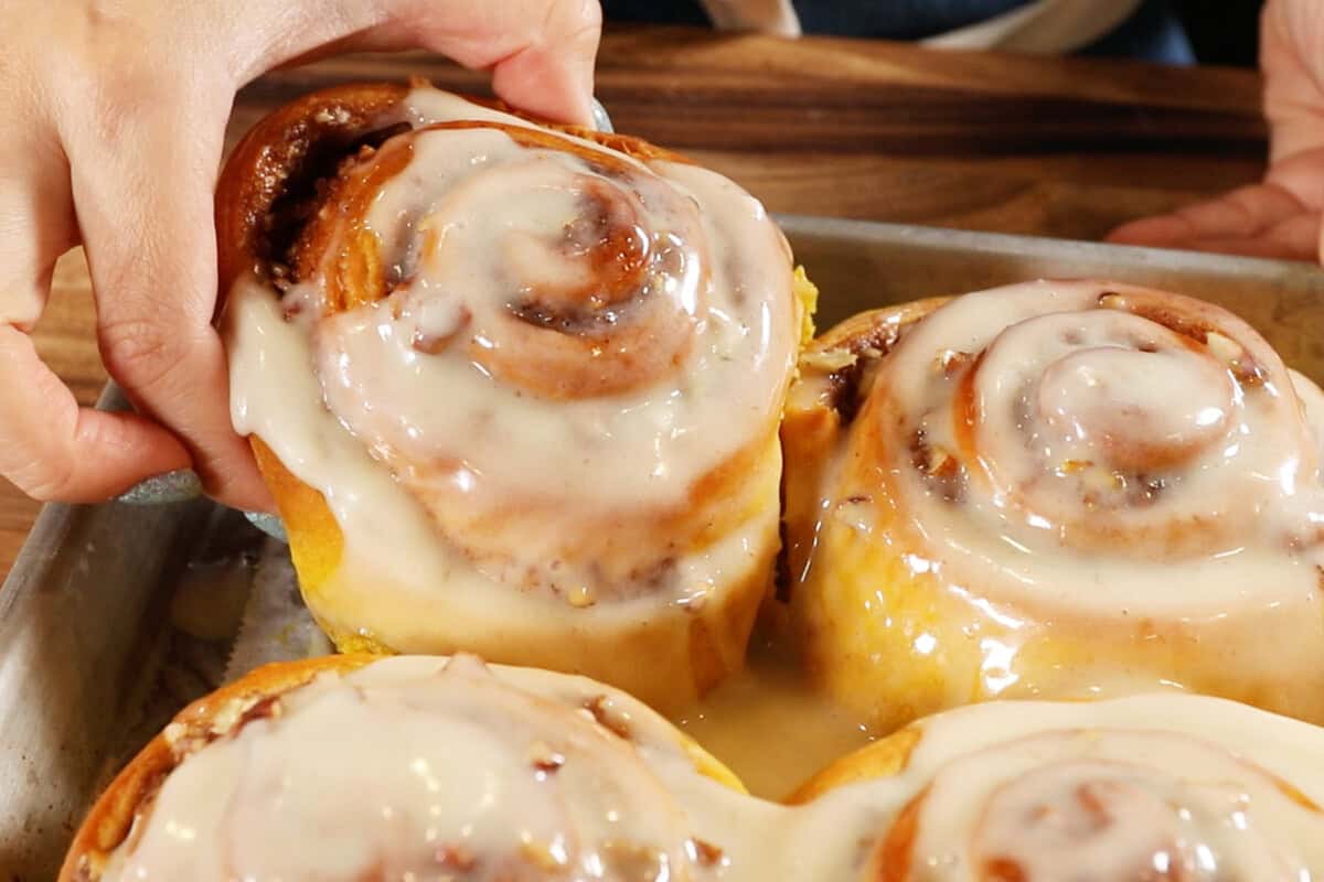 finished cinnamon rolls in a tray