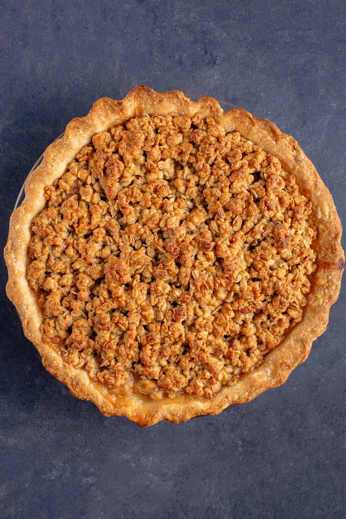 Baked Apple Crumble Pie on a blue background