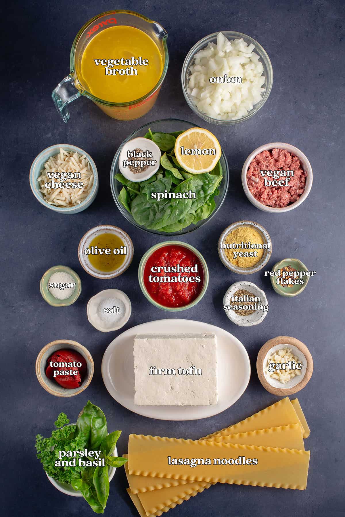 vegetable broth, onion, vegan cheese, black pepper, lemon, spinach, vegan beef, olive oil, crushed tomatoes, nutritional yeast, red pepper flakes, italian seasoning, salt, sugar. tomato paste, firm tofu, garlic, lasagna noodles, parsley and basil