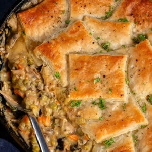 a skillet of Vegan Mushroom Pot Pie with golden puff pastry squares