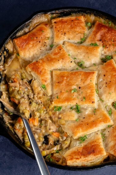 a skillet of Vegan Mushroom Pot Pie with golden puff pastry squares