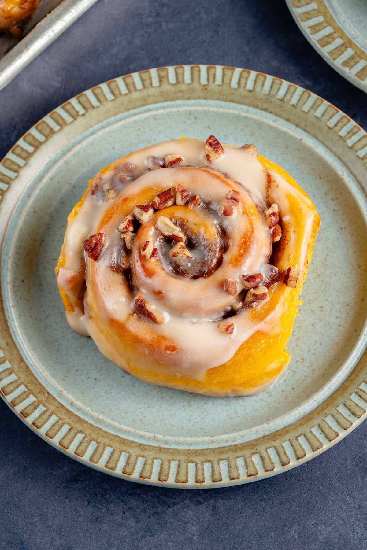 vegan pumpkin cinnamon rolls on a plate