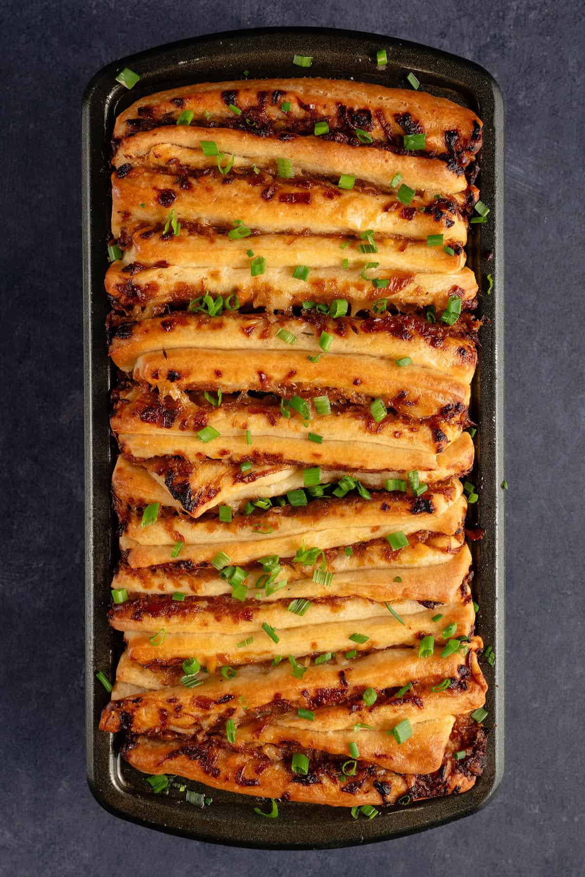 golden French Onion Pull Apart Bread in loaf pan after baking