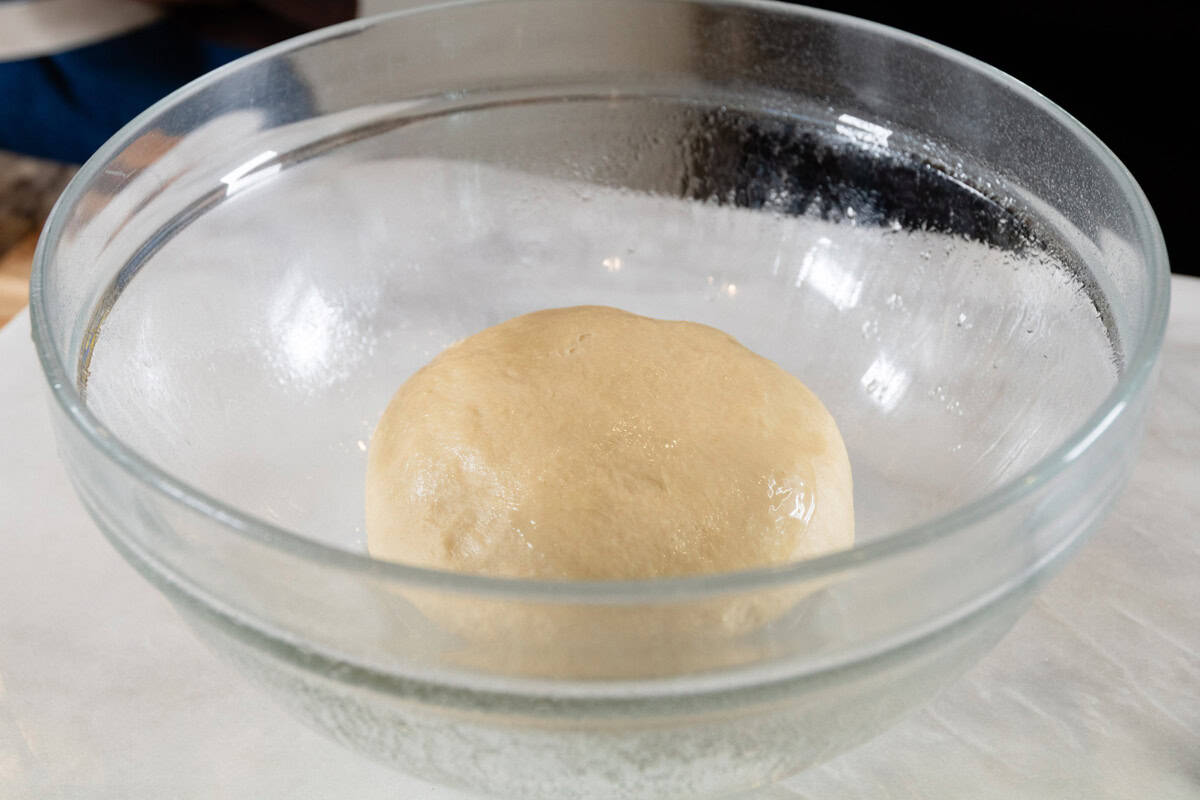 unrisen dough in large glass bowl