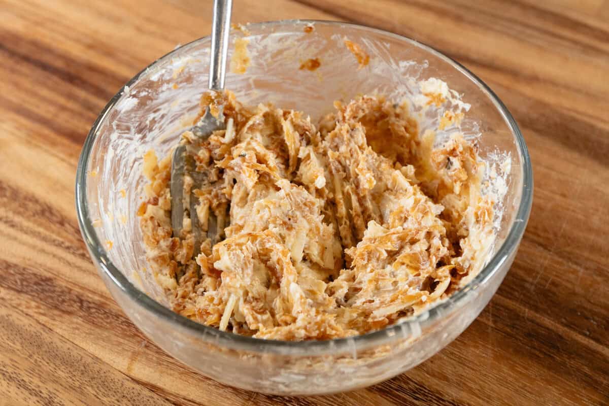 caramelized onions butter and cheese in glass bowl