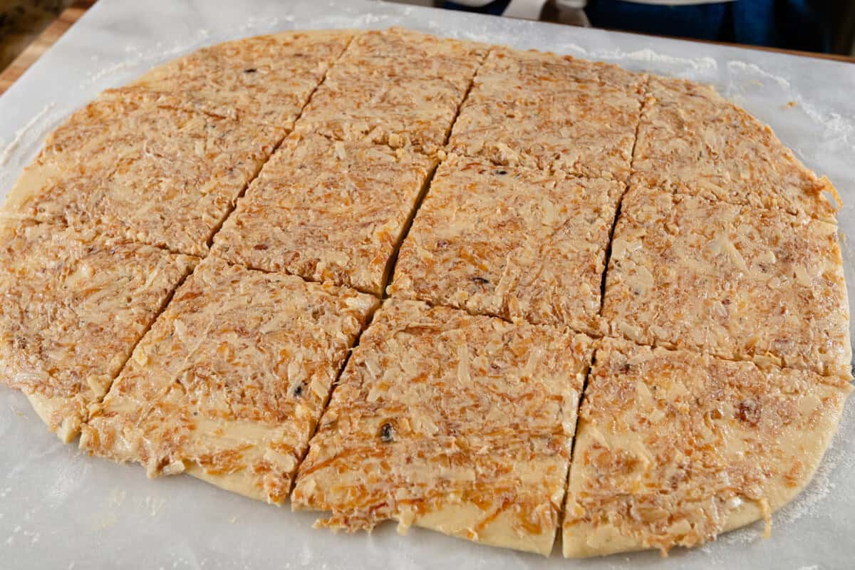 caramelized onion butter on flattened dough squares
