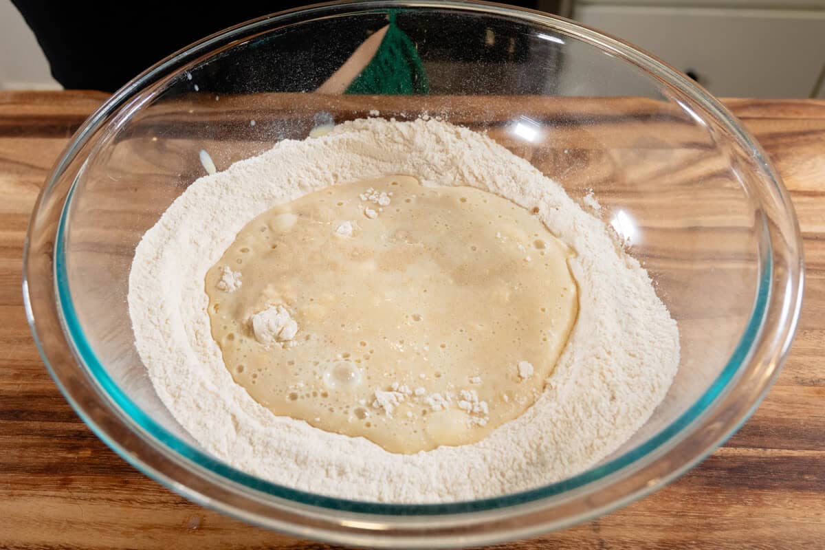 mixing the dough ingredients for French Onion Pull-Apart Bread in glass bowl