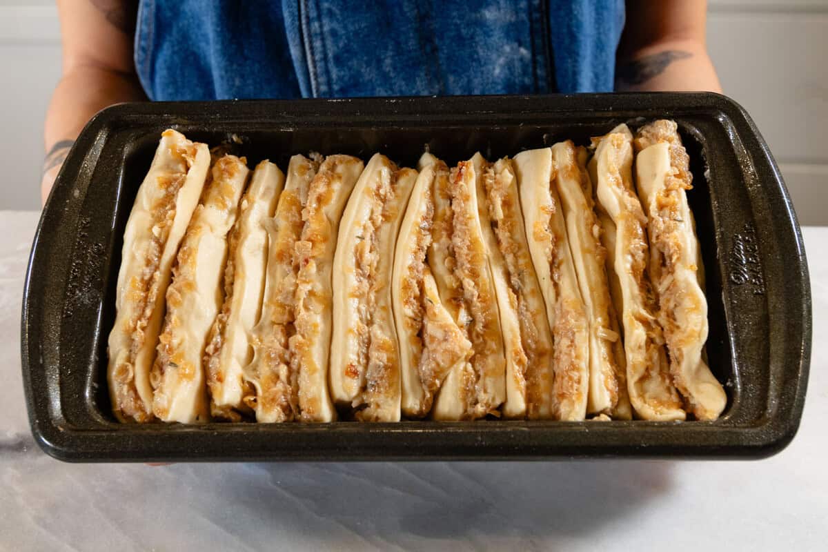 unbaked french onion pull-apart bread in loaf pan