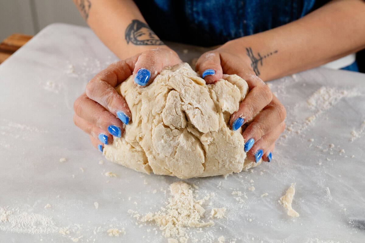 kneading the dough for French Onion Pull Apart Bread on marble surface